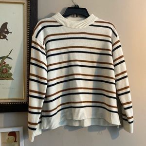 White sweater with black and brown stripes